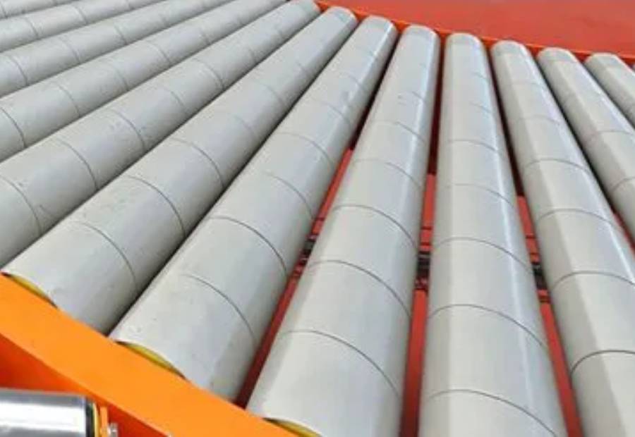 Plastic conveyor roller moving small boxes on conveyor line